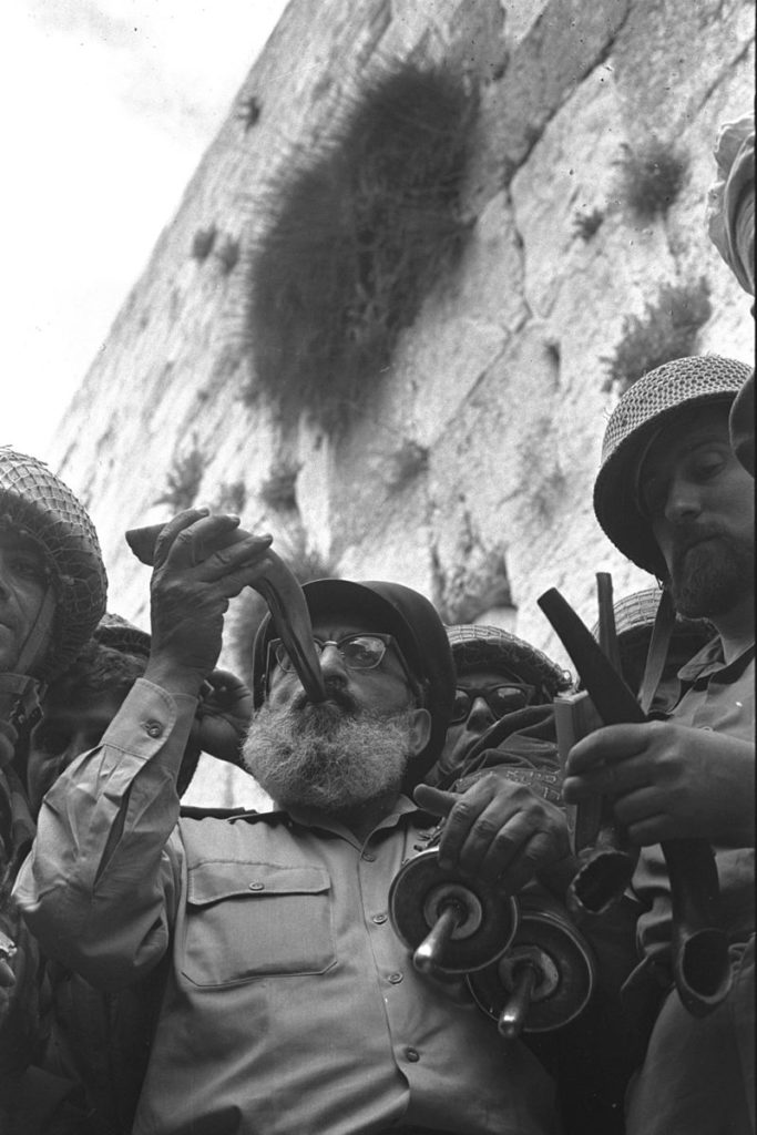 IDF soldiers and chaplain rabbi celebrate at the Western Wall in June, 1967.